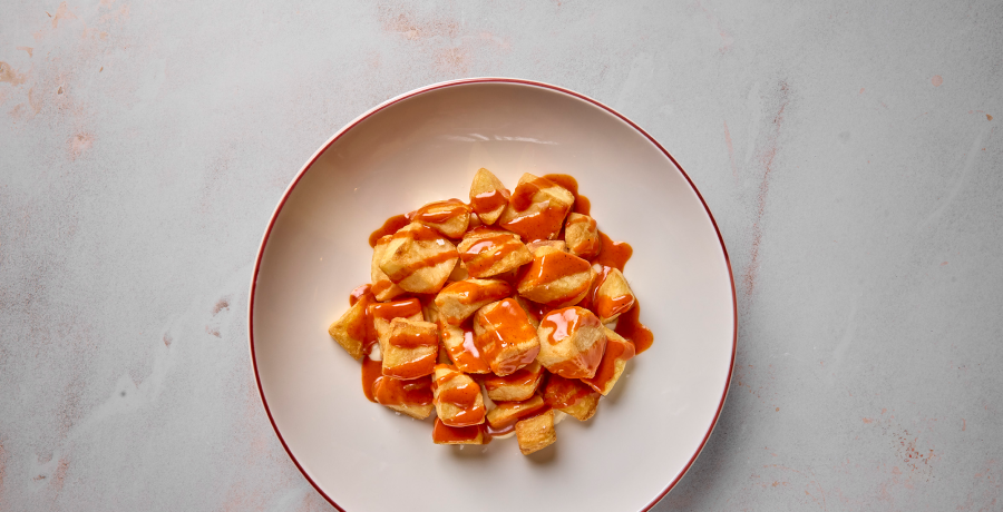 Plate of patatas bravas at Museo del Jamón in Madrid